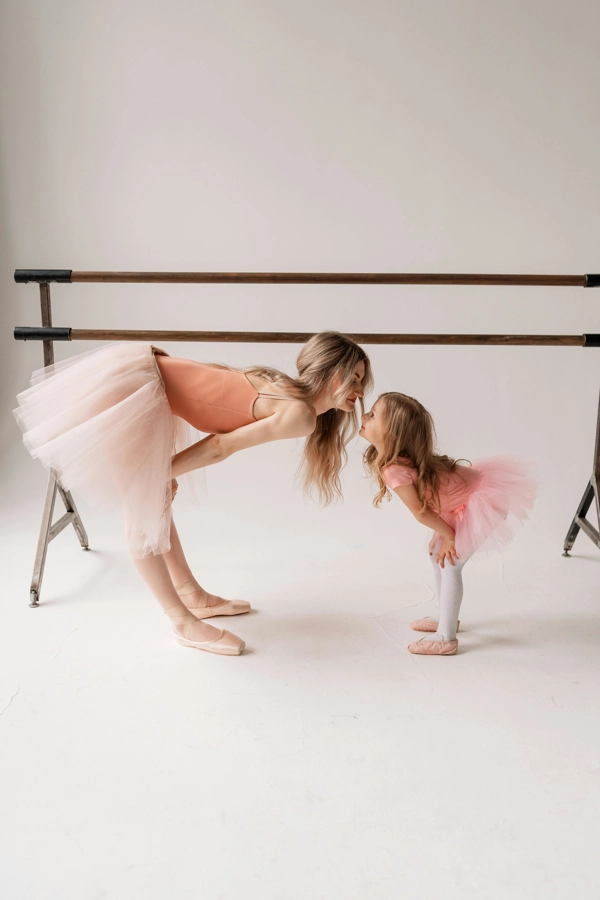 Teacher and student at ballet barre