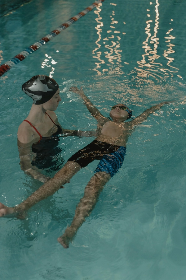 Swim students training in a pool